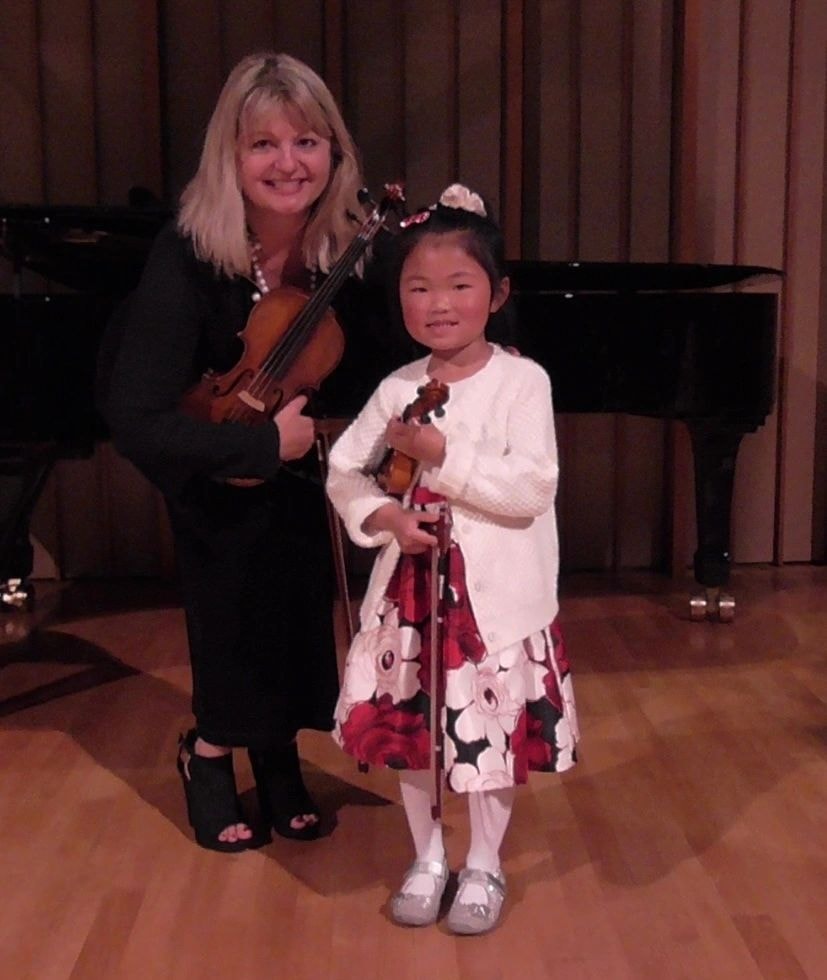 Monique Nardone with student on stage